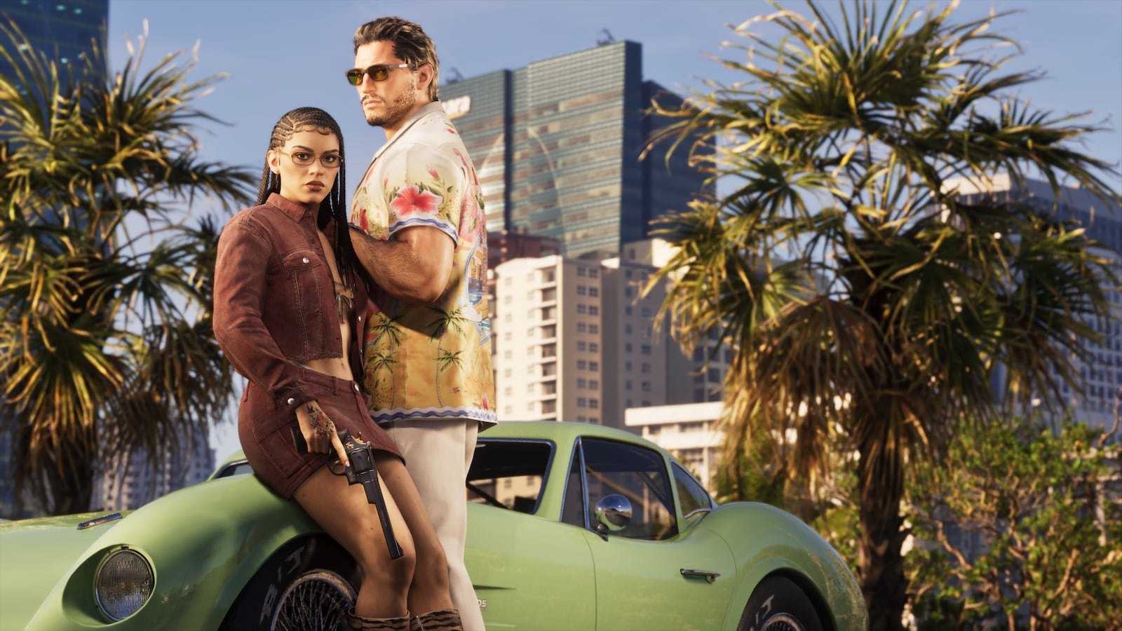 A woman holding a gun and a man in a floral shirt pose leaning against a green classic sports car with palm trees and a city skyline in the background.