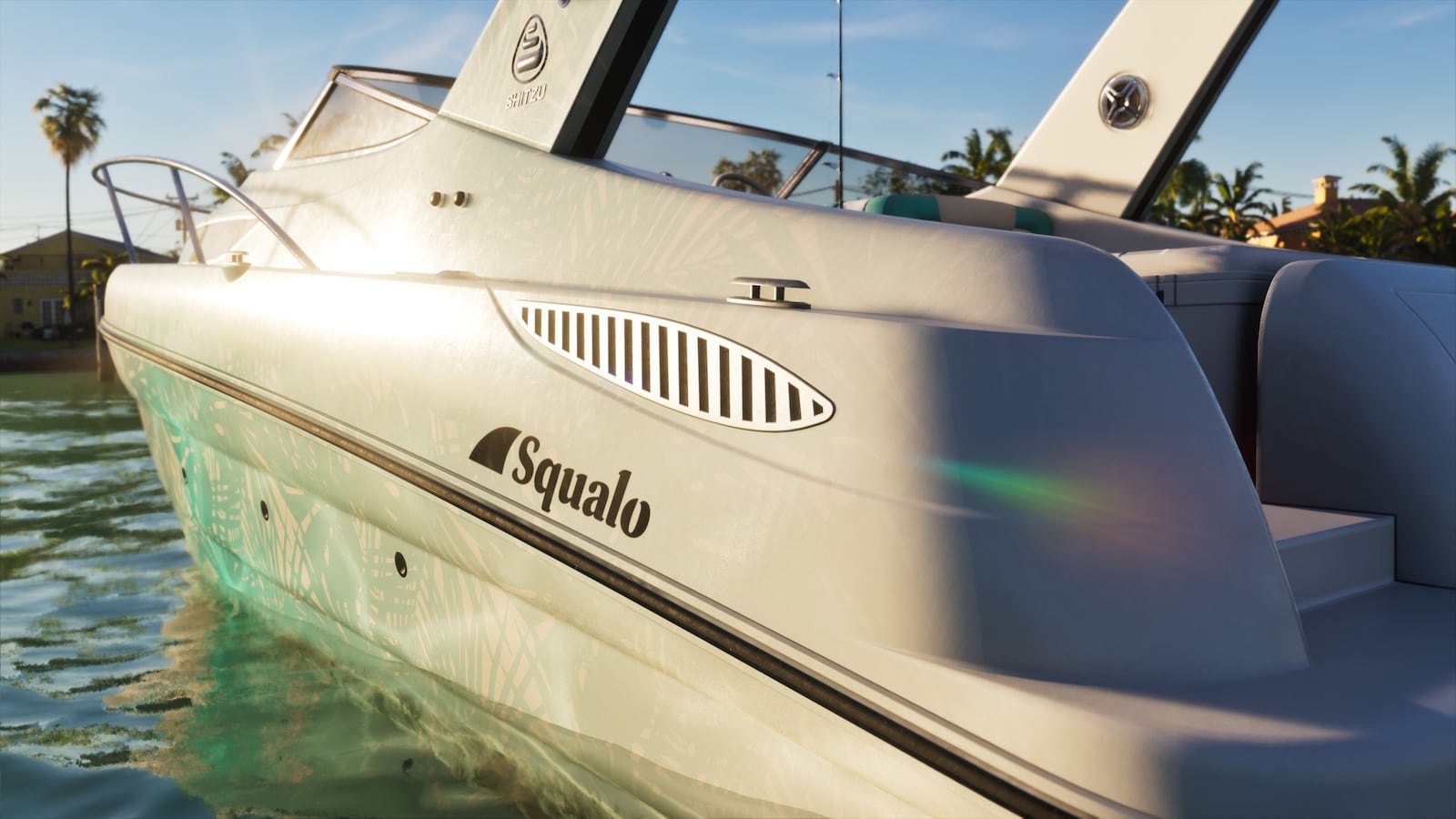 Close-up of the side of a white motorboat branded 'Squalo' floating on clear turquoise water near a tropical shoreline.