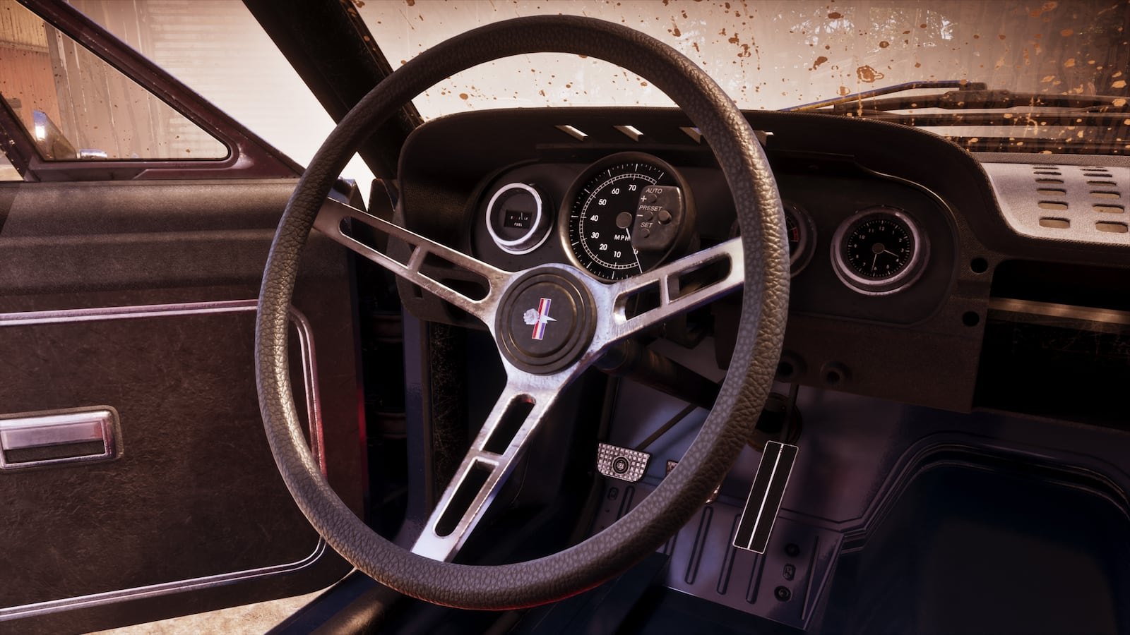 Interior view of a classic muscle car showing a three-spoke steering wheel with a pony emblem and vintage dashboard gauges.